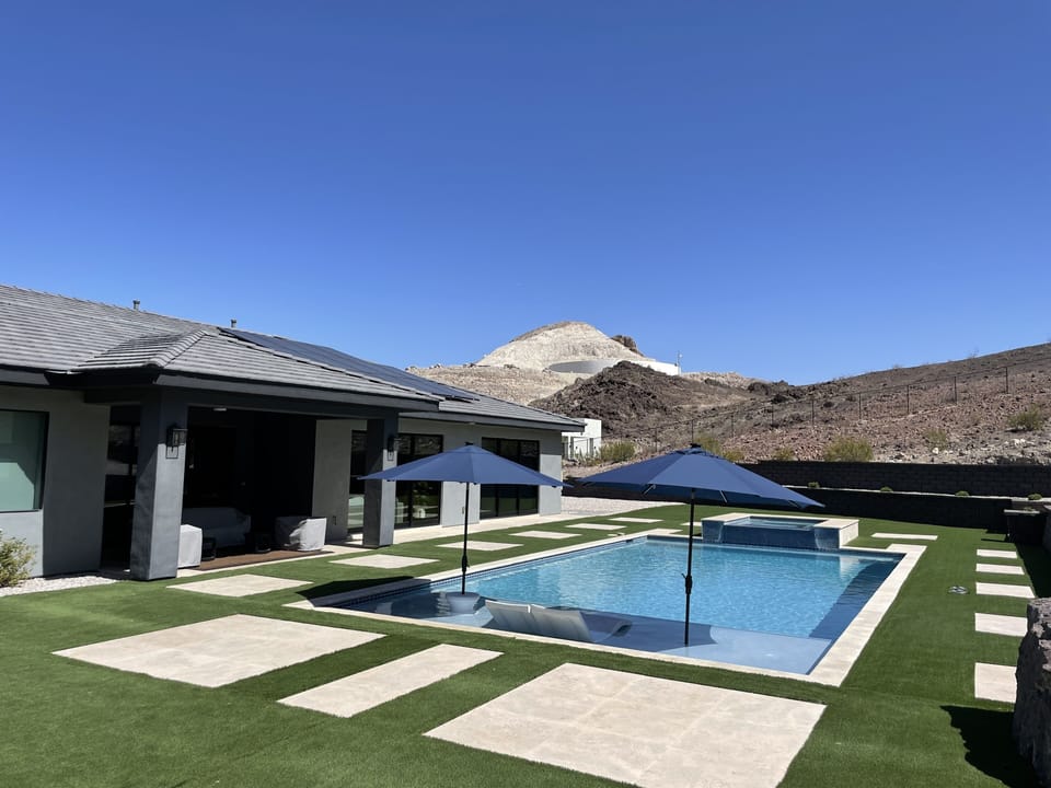Backyard custom oversized pool and putting green (4 holes)