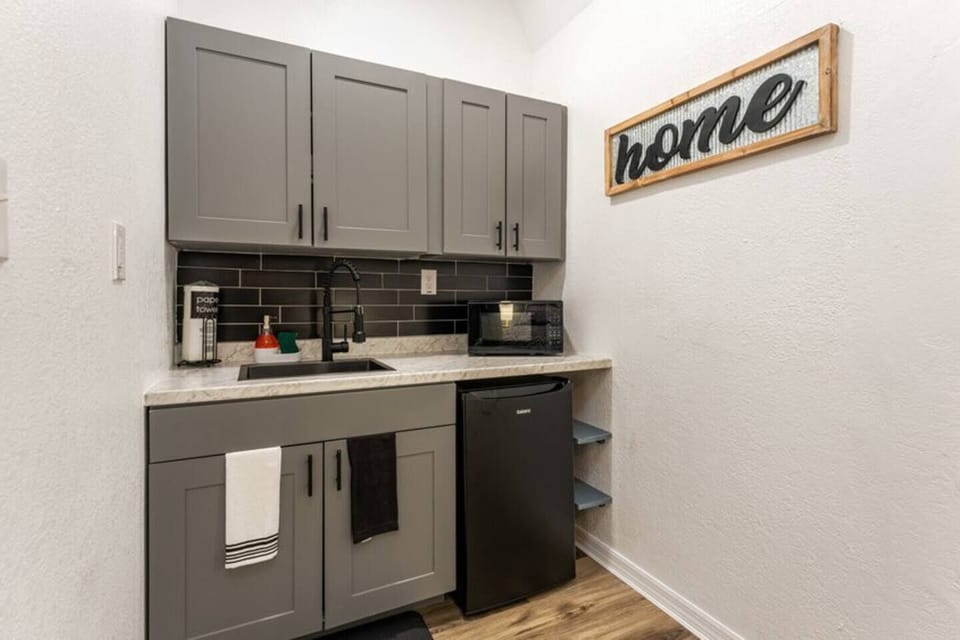Kitchenette with portable stove with two burners and minifridge