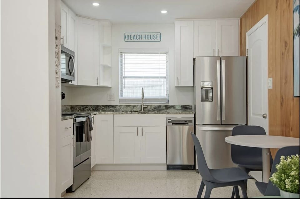 Full kitchen with fridge and dishwasher