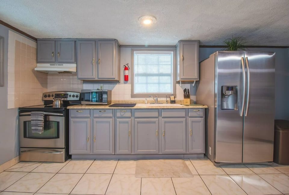 kitchen with cabinets that provide efficient storage and a contemporary touch.