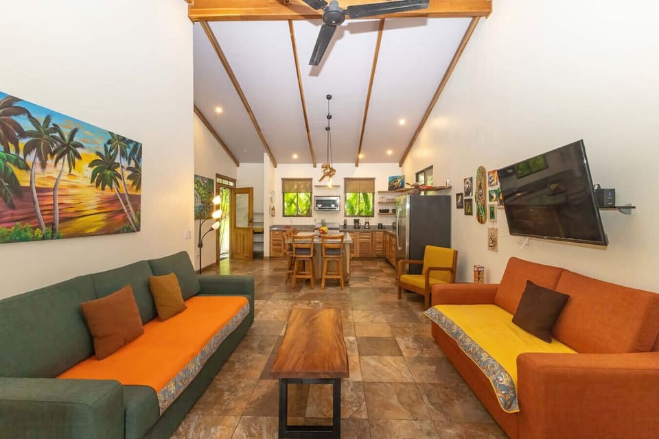 Living area is spacious, has smart TV, comfy furniture