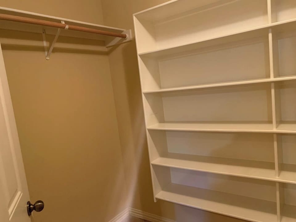 Master closet side 2...with more hidden behind the door.