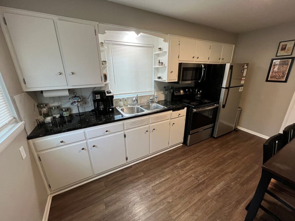 Stocked Kitchen!  Utensils, place settings, pots & pans, crock pot, basic spices