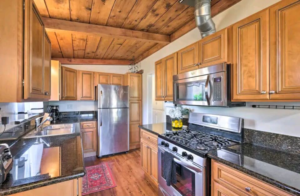 This kitchen is fully equipped for a convenient cooking and baking experience.