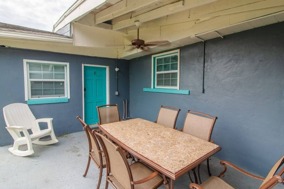 This outdoor area features comfortable seating, perfect for relaxing and enjoying the fresh air.