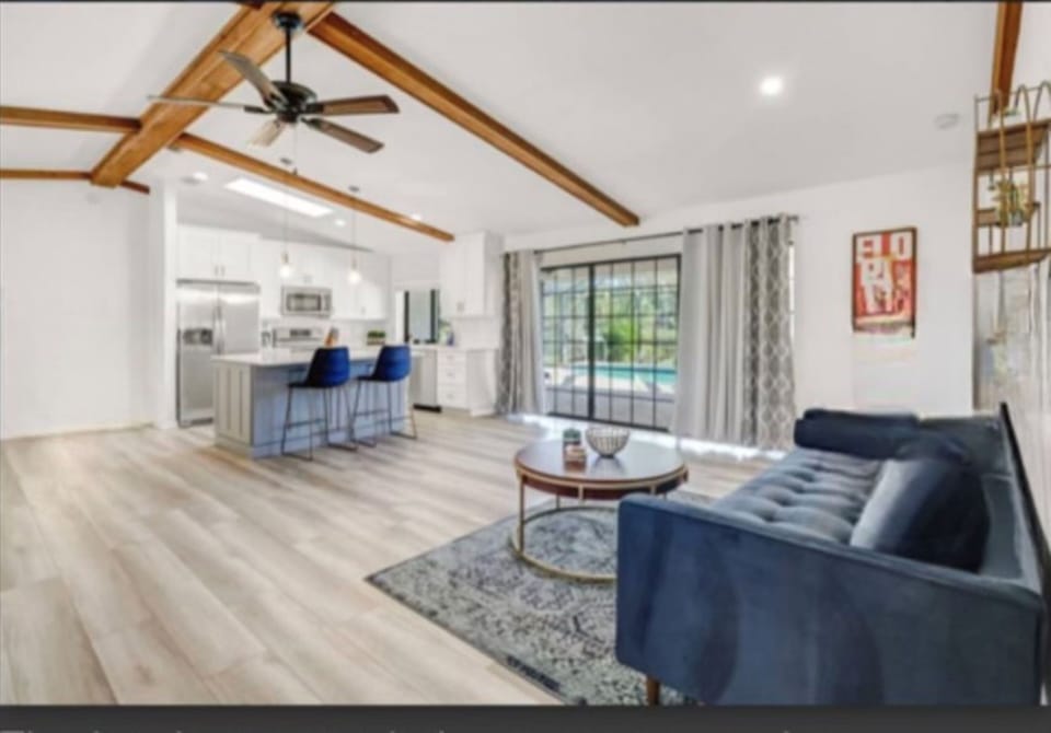 The kitchen island creates a convenient workspace or spot to grab a quick bite.