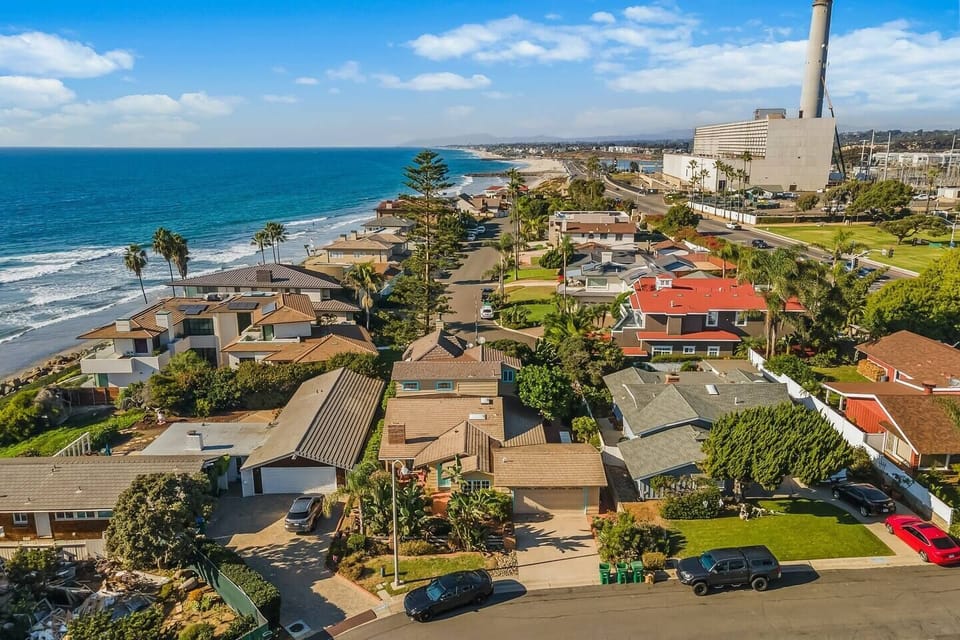 Located walking distance to the beach (bottom middle home with teal trim)