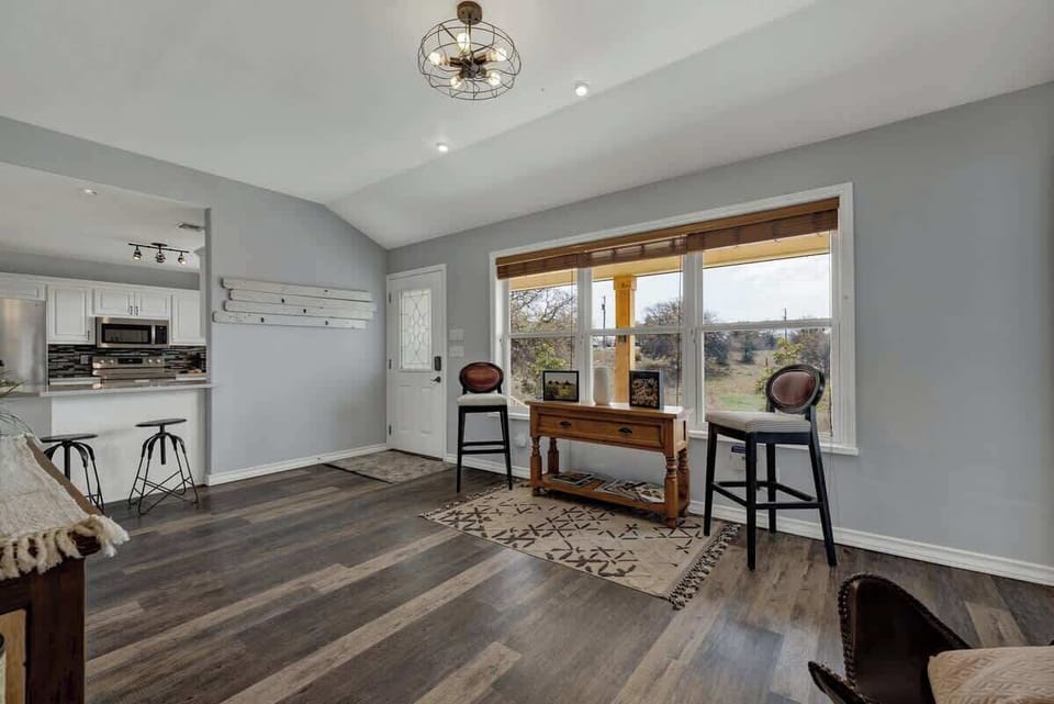 Bright entryway with seating for two.
