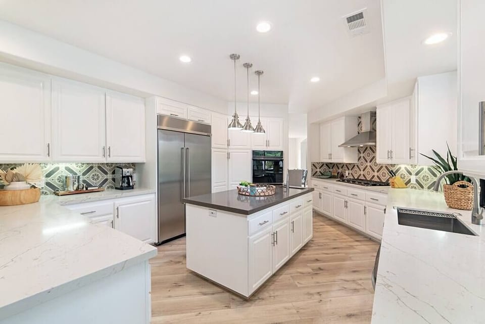 The kitchen is spacious enough for all your friends and family to pitch in with diner or hang out as you cook