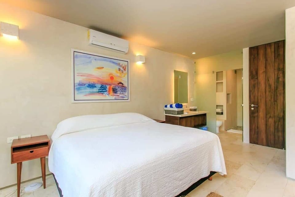 The master bedroom has an ensuite private bathroom