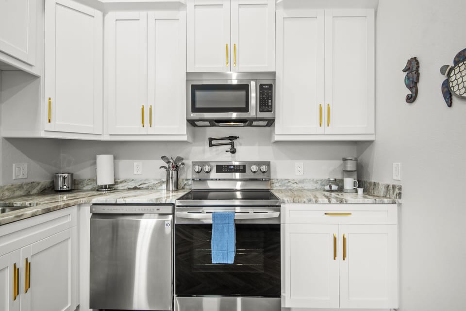 Full kitchen with appliances.