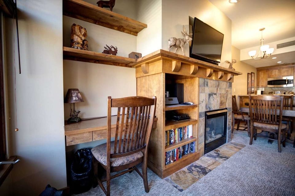 Built-in desk area near the fireplace—perfect for remote work or planning your mountain adventures.