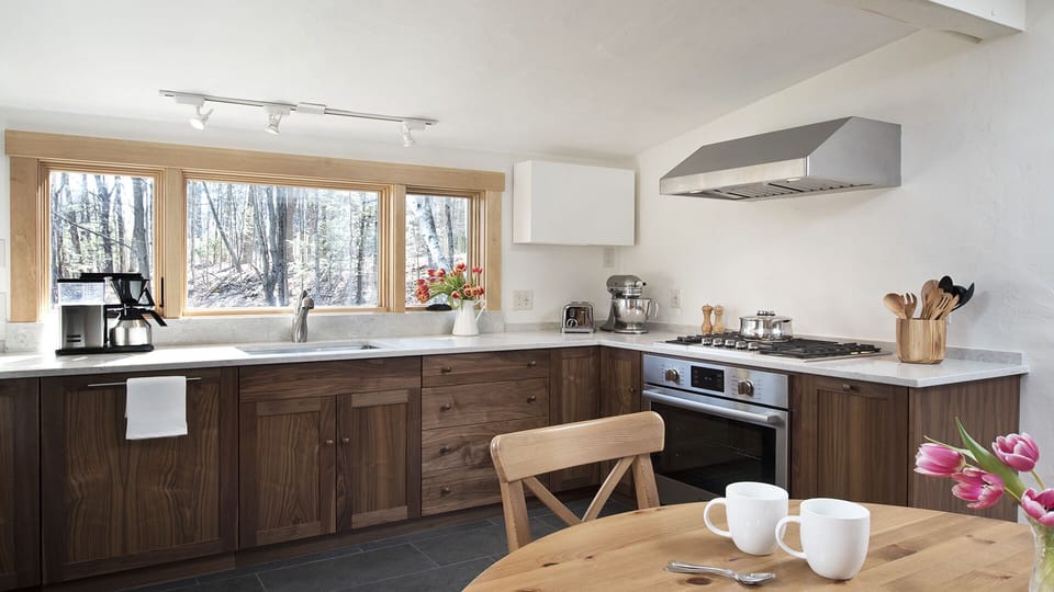 Your fully-equipped kitchen features a Caesarstone counter + new appliances…