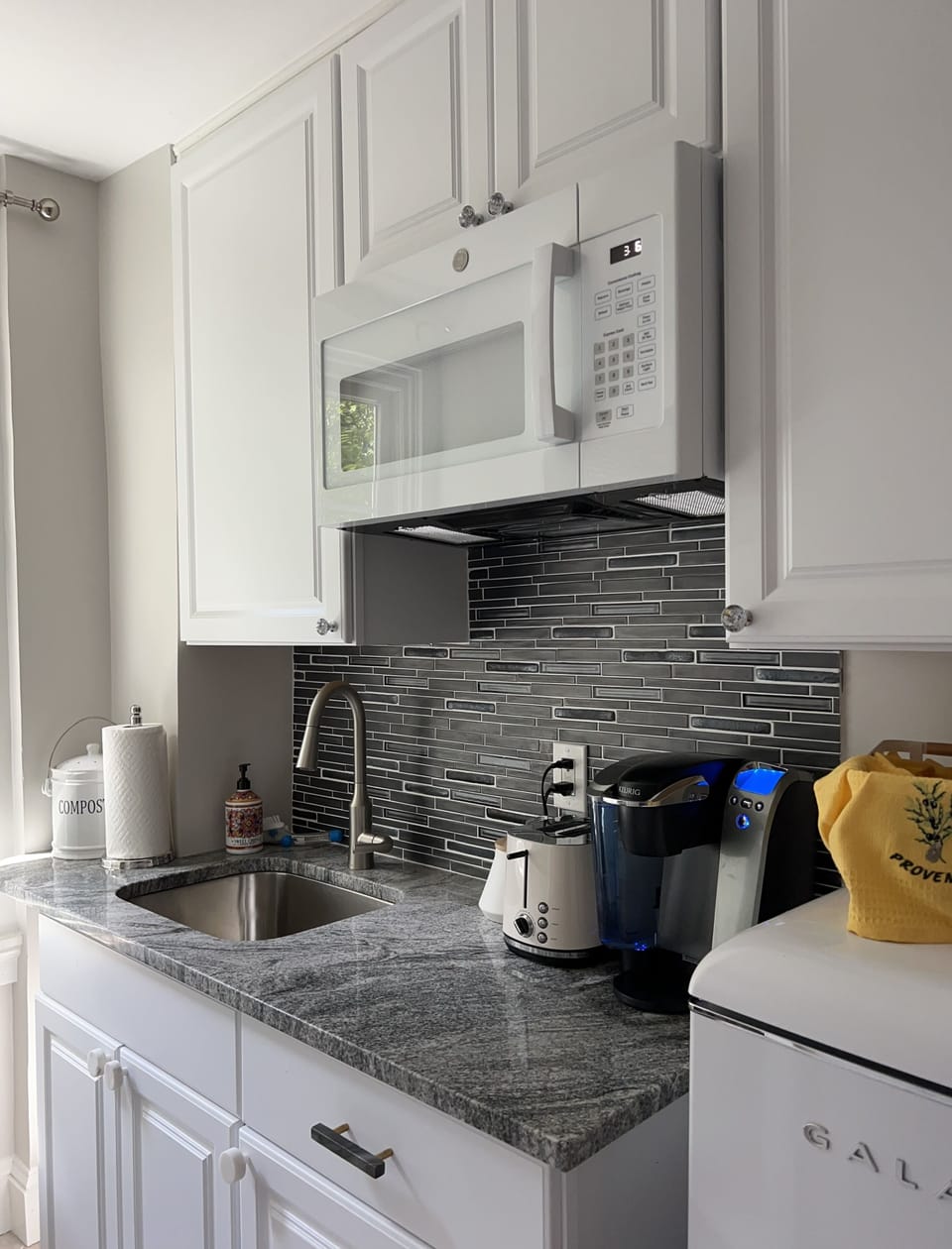 Fully furnished modern kitchenette.
