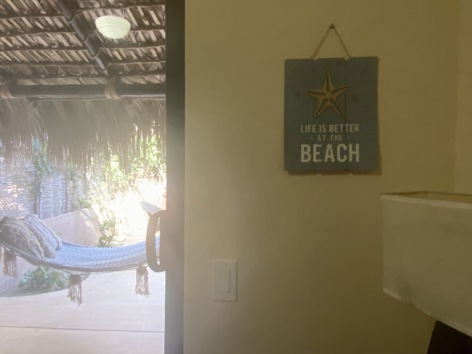 The downstairs bedroom with Queen bed opens onto the patio