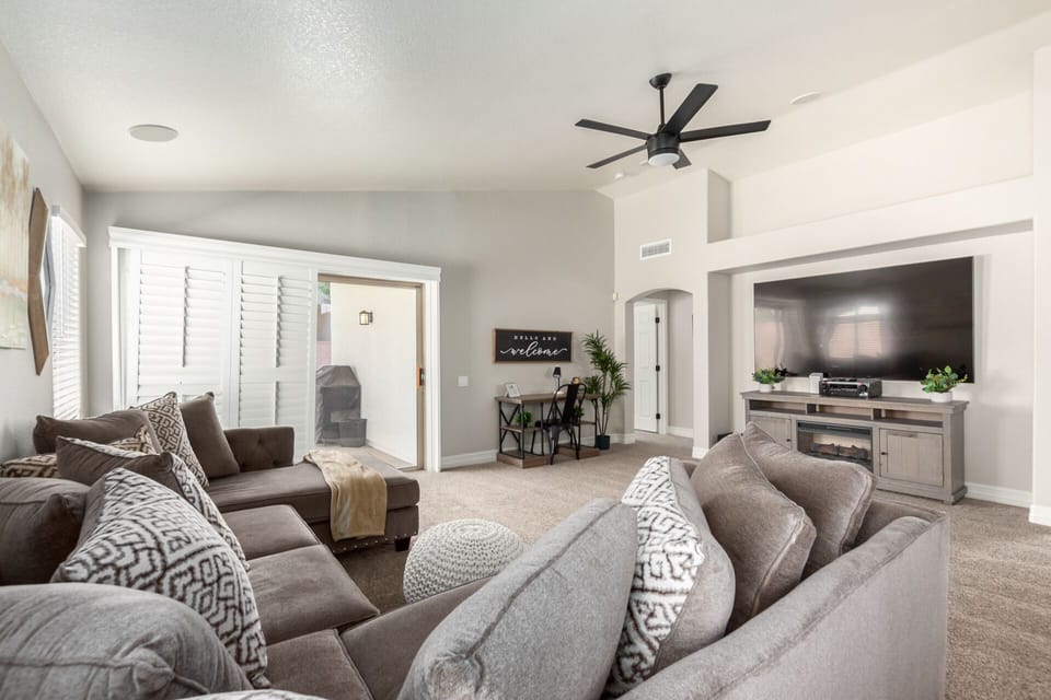 Comfortable living space with ample seating, Smart TV, dedicated work space