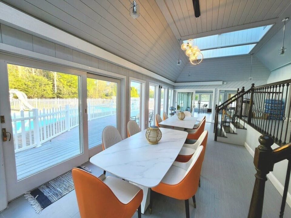 Dining area with natural light and pool view
