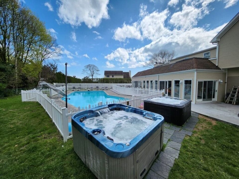 Full view of the pool and hot tub area
