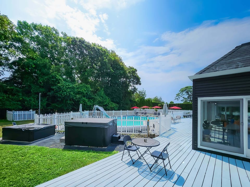 Full view of the pool and hot tub area