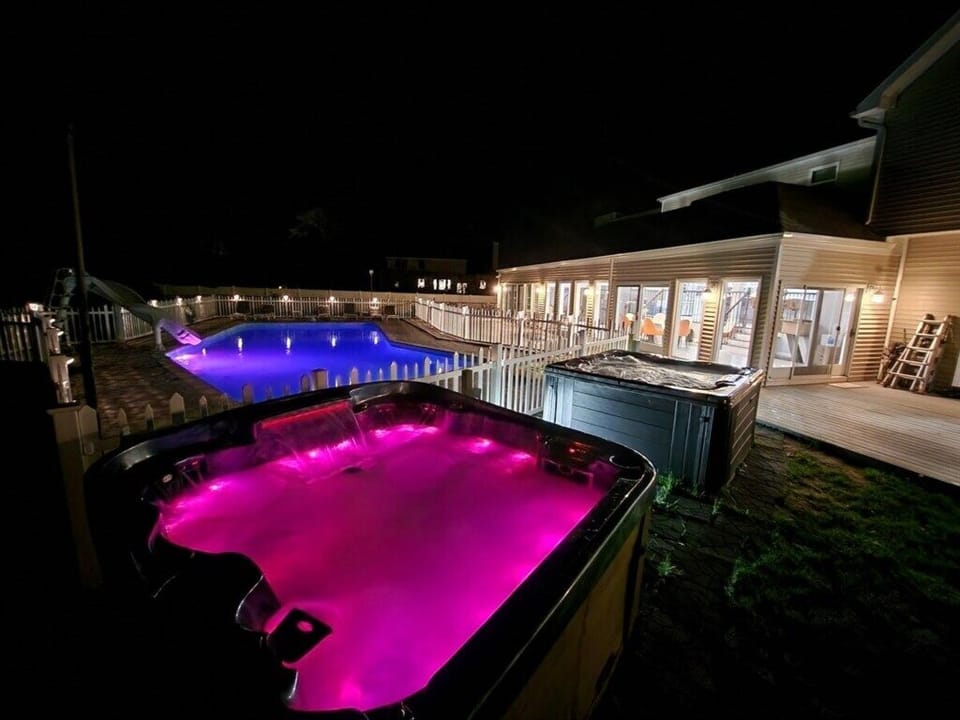 Evening dip under the stars in your private lit pool and large hot tubs.