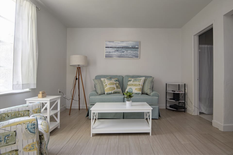 Cozy living room with sofa and recliner.