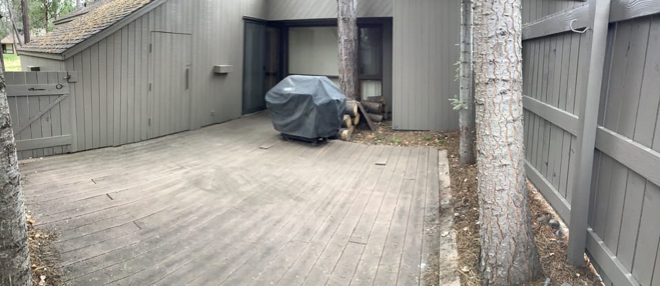 Back patio with BBQ, chairs in the storage shed