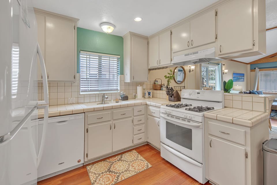 Fully-stocked kitchen with bar stool seating