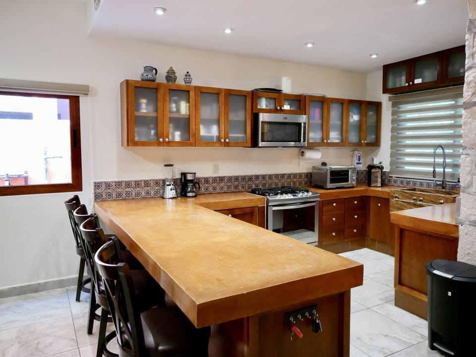 Complete kitchen with breakfast bar.