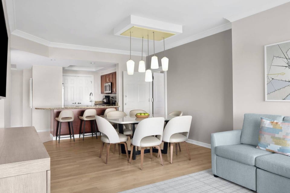 Separate dining area with a table for 6 and extra counter seating.