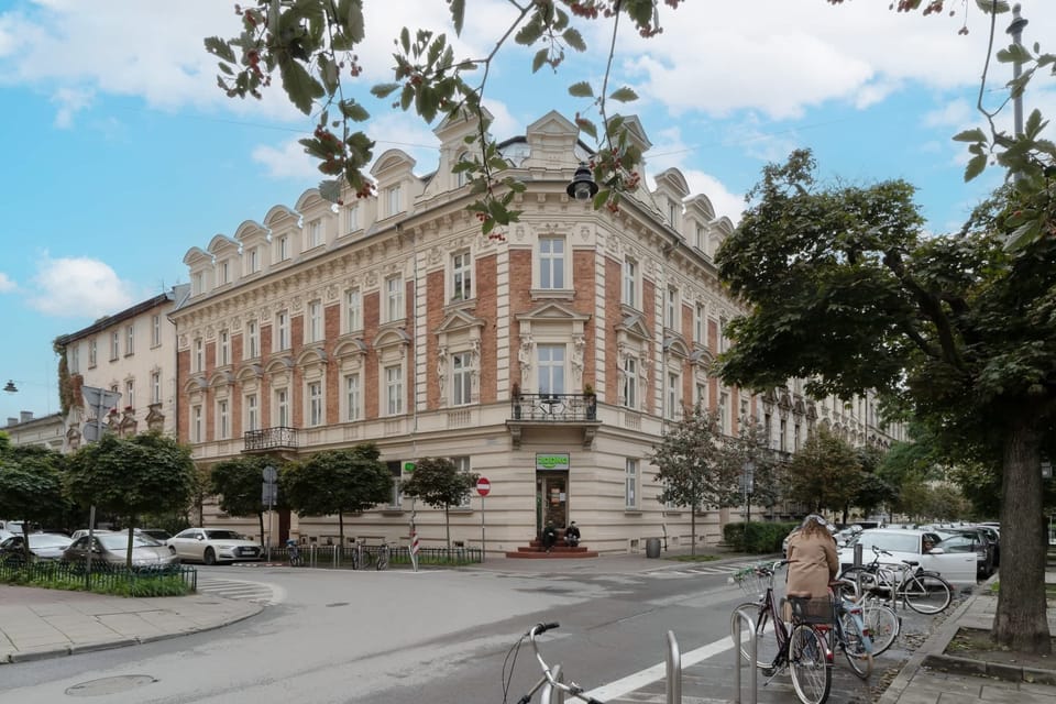 An exterior view of a grand, historical building with intricate architectural details.
