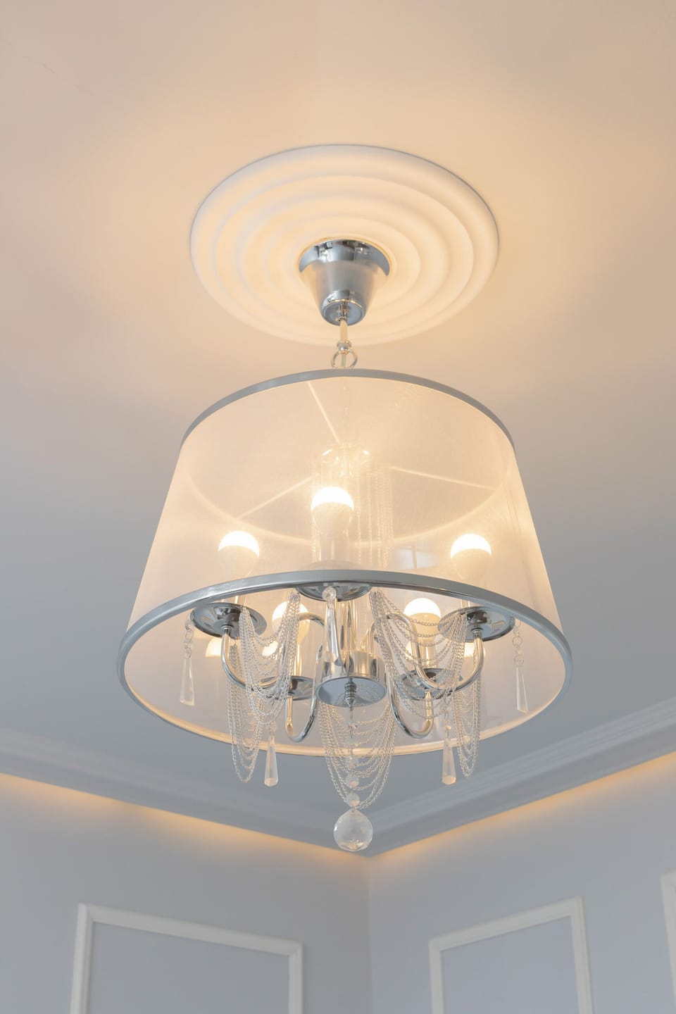 A chandelier with a classic design, adding elegance to the room's ambiance.
