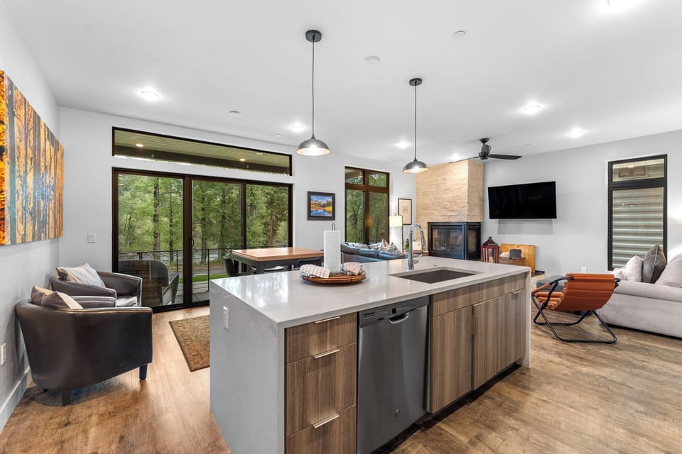 Full-sized luxury kitchen with breakfast bar seating.