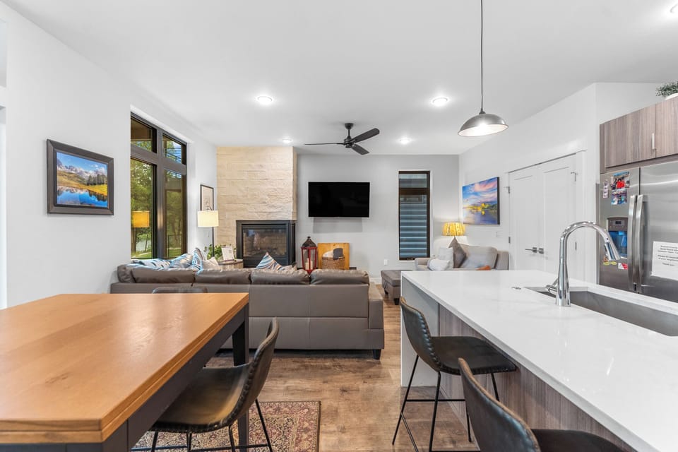 Open-concept, living, kitchen, and dining area.