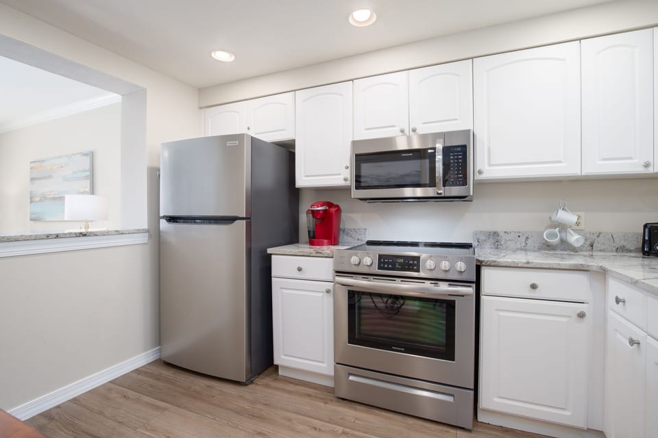 The kitchen is great for cooking meals on vacation.