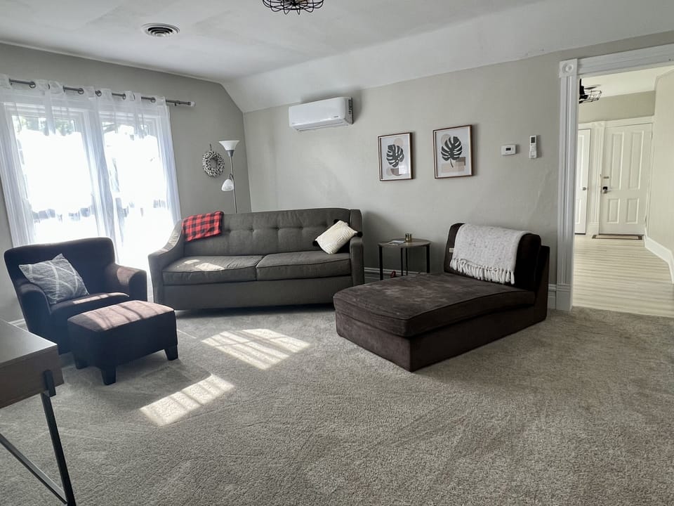 Living room with lots of seating and smart tv