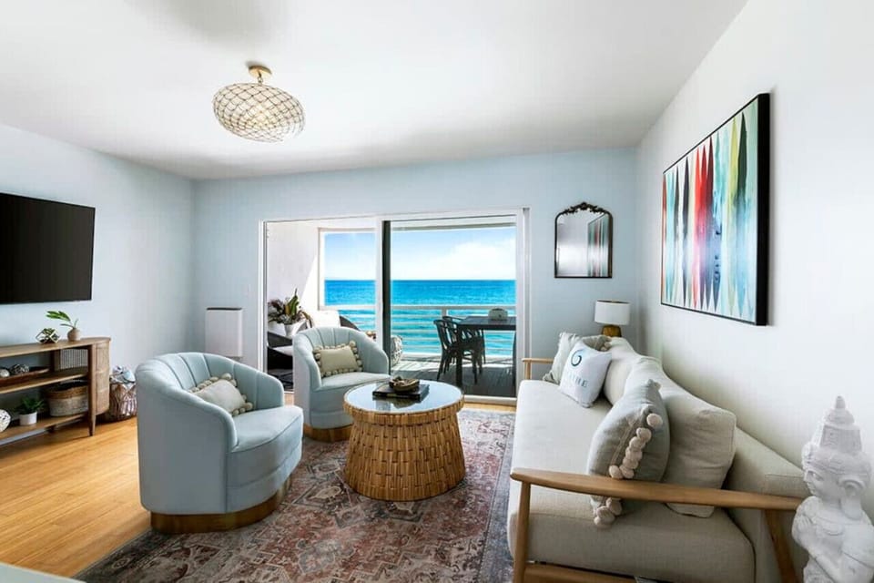 Step into a luxurious living area haven, complete with a balcony offering ocean breezes and breathtaking views—perfect for the ultimate vacation escape.