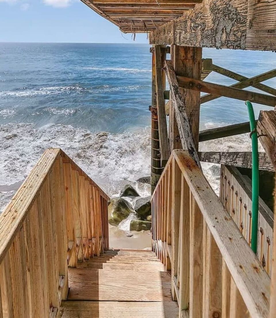 Enjoy the pristine shores of Los Flores Beach with direct access via the stairway on the left side of the property—perfect for a refreshing seaside escape.