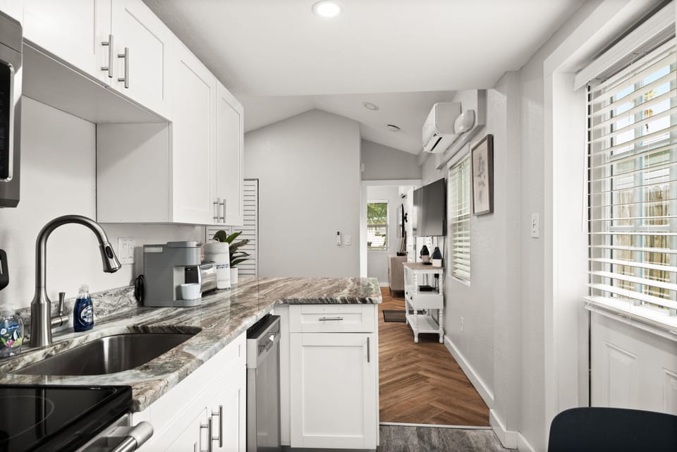 Full kitchen with appliances.