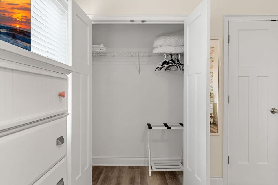Primary bedroom with king bed, two large closets, smart TV and en-suite bathroom.