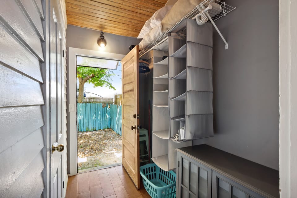 Walk-in closet with access to the backyard