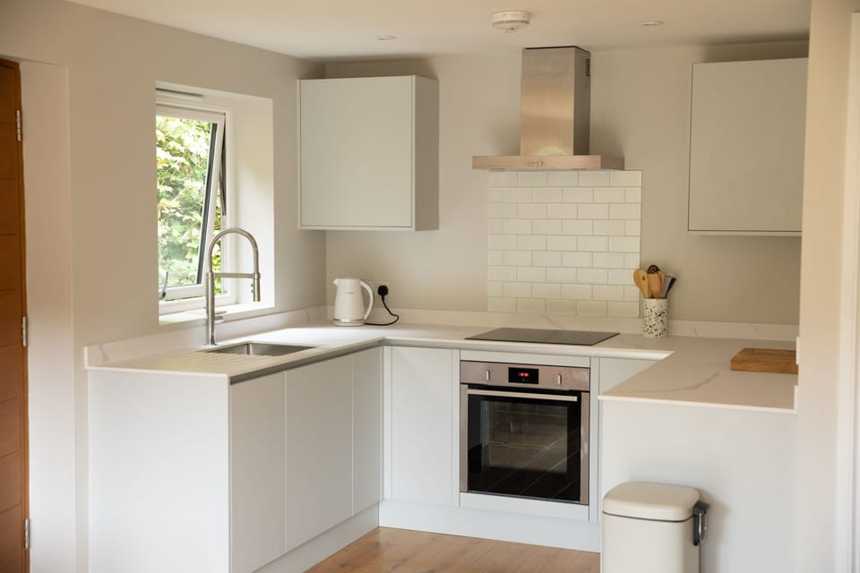 Fully equipt kitchen with Aeg induction hob and Neff hide and slide oven. 
