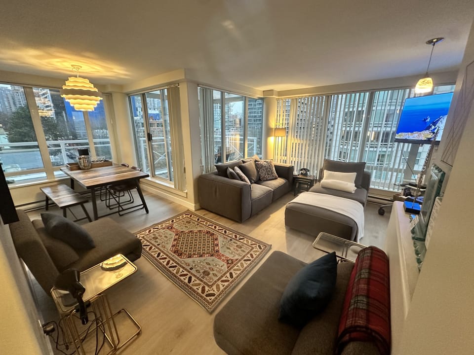 Modern living room with multiple patio space and dining area.