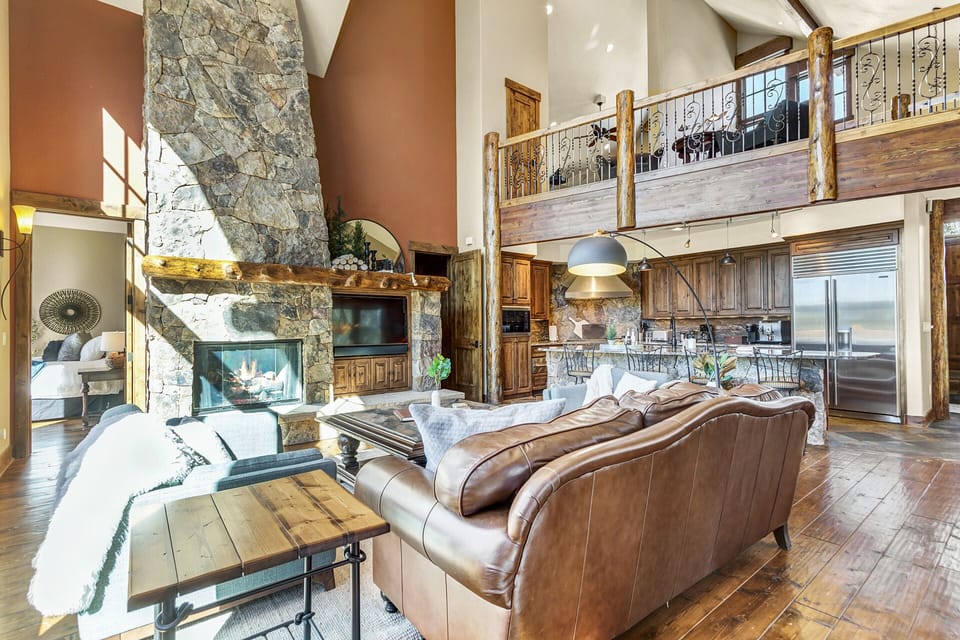 Open Concept Living: The open kitchen/living/dining area is crowned with an overlooking loft, perfect for entertaining or relaxing in a spacious environment. 