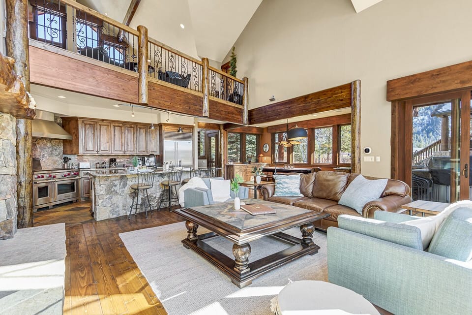 Spacious and Inviting Living Area: The main living area features oversized seating perfect for gatherings or quiet evenings by the fireplace. 