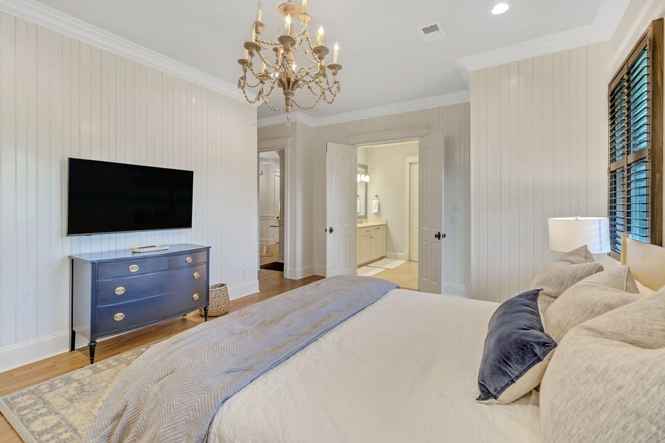 Bedroom 4 with King, TV, and en-suite. First Floor