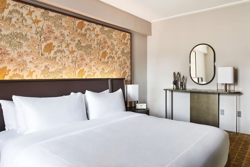 Unwind in a serene bedroom with designer touches and calm tones.