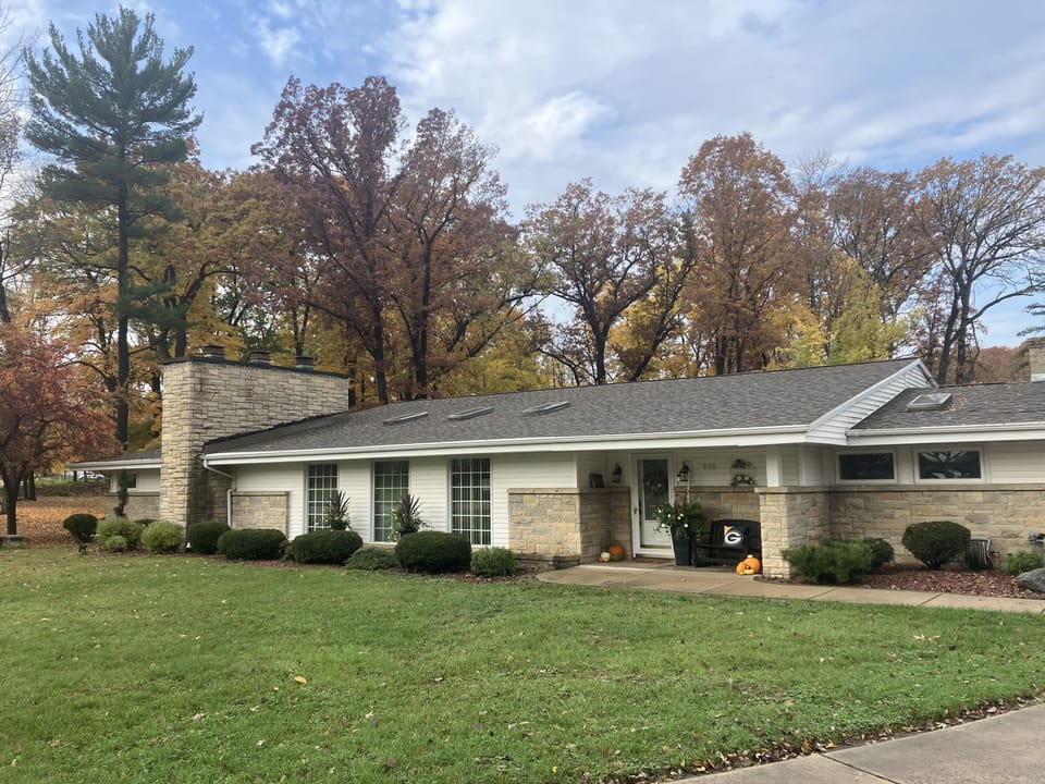 Street view of our home with autumn leaves in City Park. 