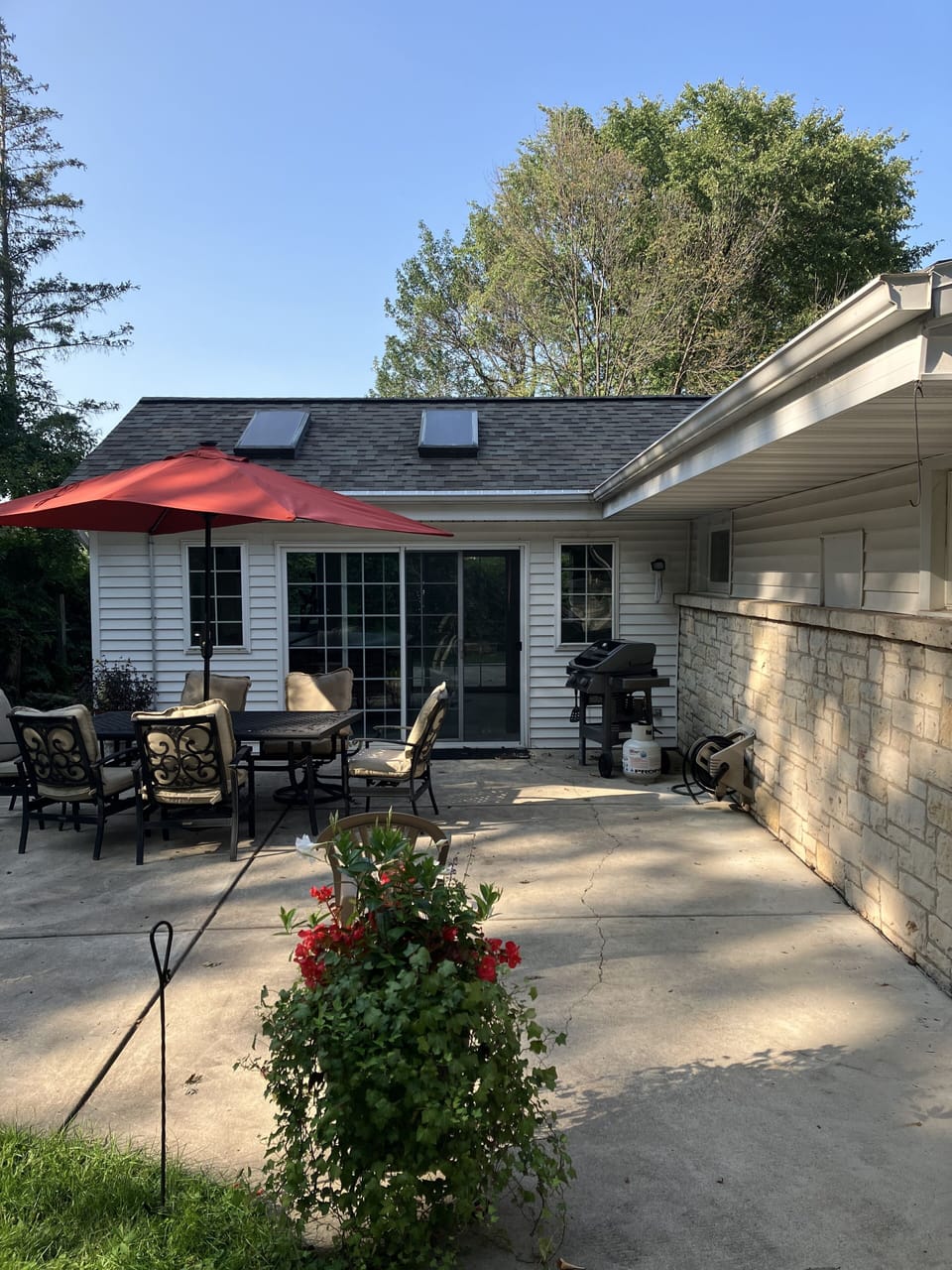 Private patio area with table/chairs for six, firepit.