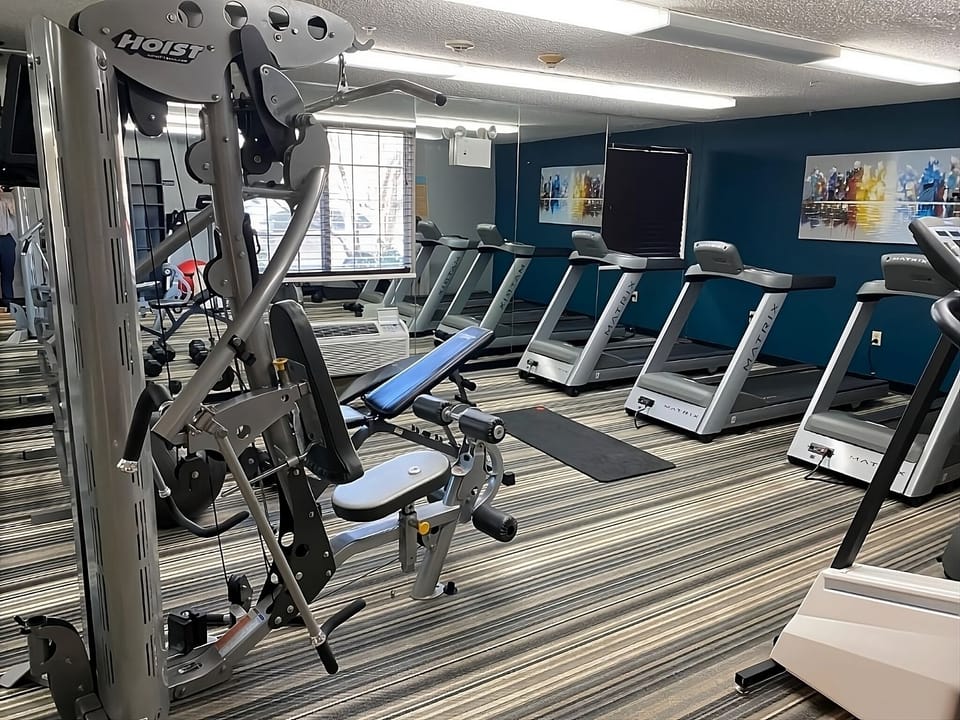 Recharge with a full workout in the bright fitness room.