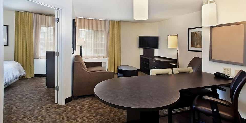 Unwind in the spacious suite with lounge seating and TV.